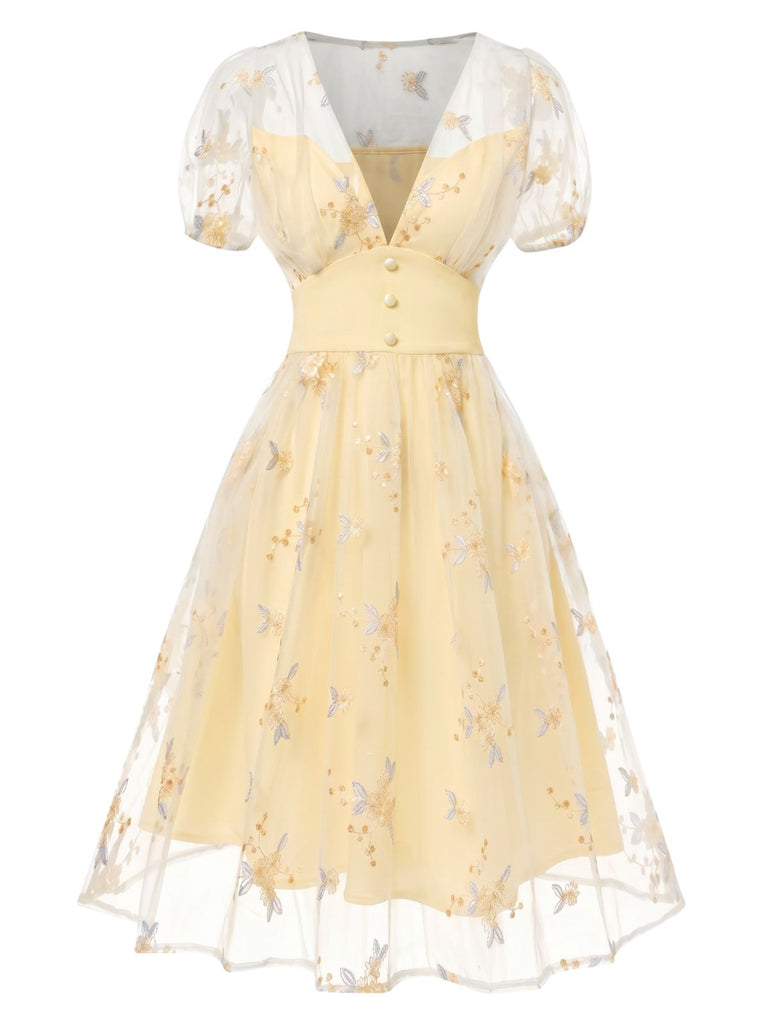 Gelbes 50er Kleid mit V-Ausschnitt und Blumen
