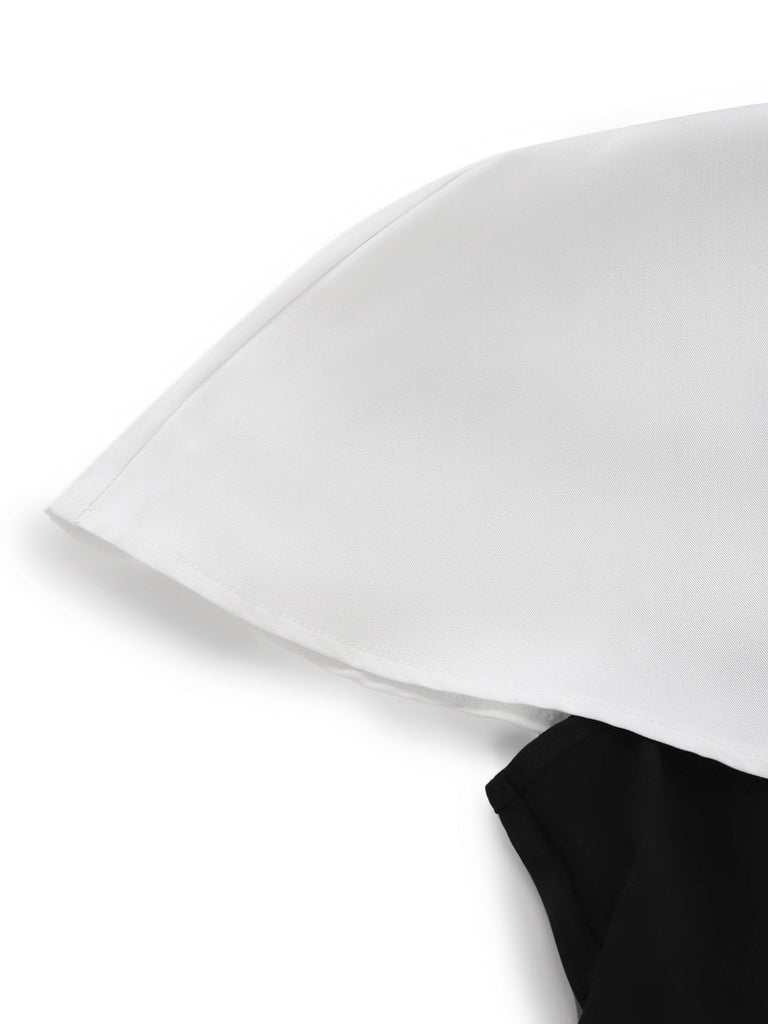 2-teiliges Set im Stil der 1950er Jahre: Schwarz-Weißes Cape-Kragen-Farbblock-Oberteil, Hose und Manschettendetails.