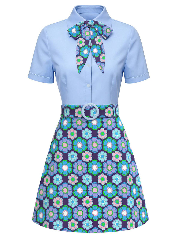 Hellblaues Kleid mit floral gemusterter Schleife und Rock auf weißem Hintergrund