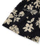 Schwarzer Stoff mit beigefarbenem Blumenmuster