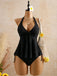 Schwarzes Tankini-Set im Stil der 1950er Jahre mit strukturiertem Blumenmuster und tiefem V-Ausschnitt (Modell)