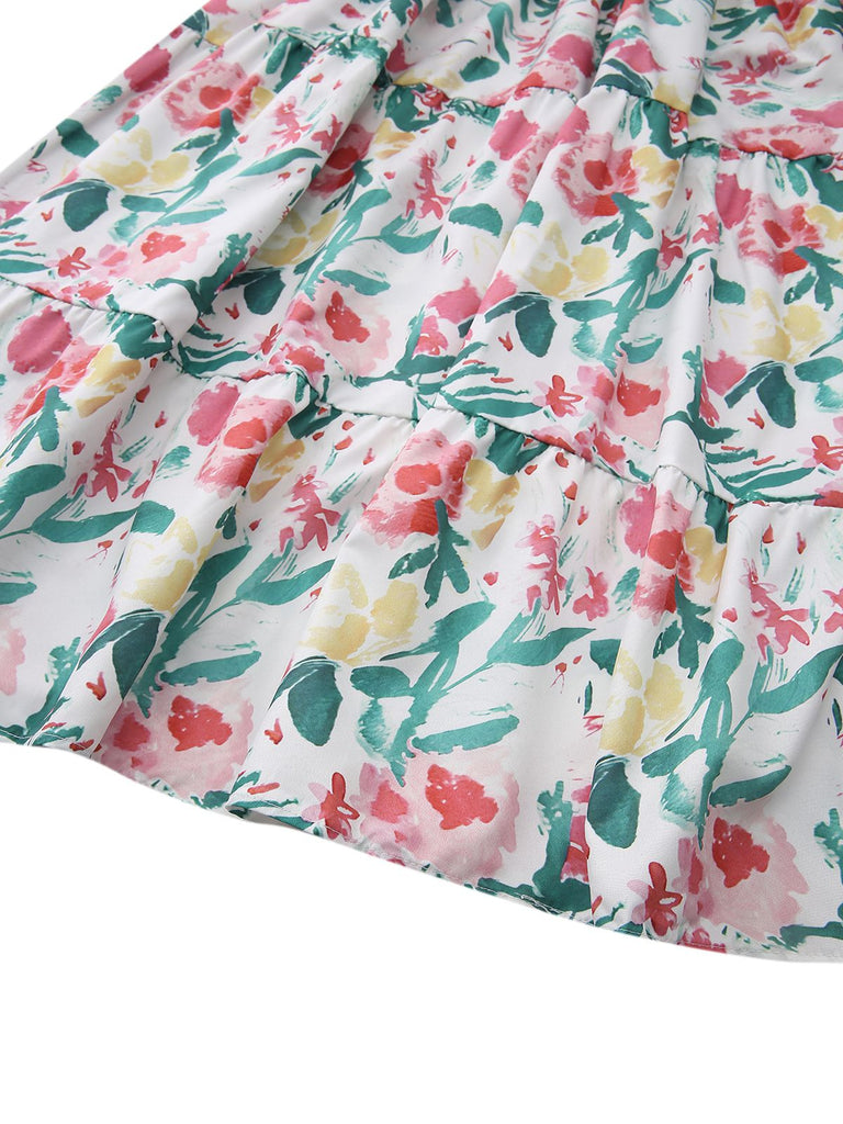 Stoff mit Blumenmuster in Rosa, Gelb und Grün auf weißem Grund