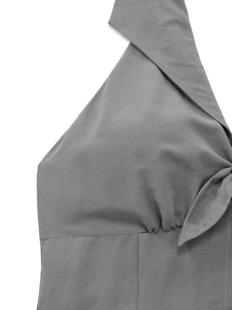 Das graue Neckholderkleid mit V-Ausschnitt besticht durch seine weiche Textur und die hochwertige Materialzusammensetzung.