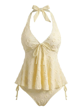 Vintage-Tankini-Set aus den 1950er Jahren mit Blumenmuster, strukturiertem Stoff und tiefem V-Ausschnitt am Neckholder – perfekt für elegante Momente am Pool.