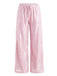 Rosa Paillettenhose auf weißem Hintergrund