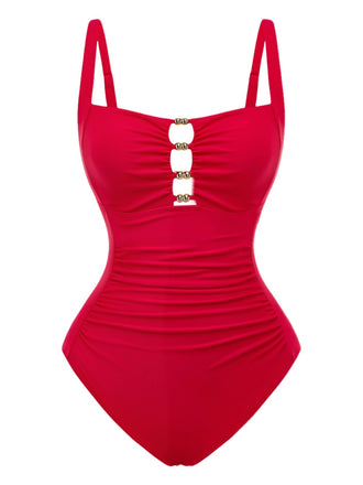Eleganter Badeanzug im Stil der 1950er-Jahre mit Cut-outs und Raffungen zur Bauchkontrolle. Kombinieren Sie ihn mit einem Sonnenhut für einen glamourösen Retro-Look am Pool.