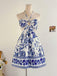 Kobaltblaues 50er Kleid mit Cut-Out und Blumen
