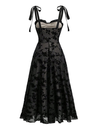 Schwarzes 50er Midikleid mit Blumen und Samt