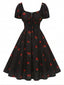 Schwarzes 50er Midikleid mit Himbeer-Print und Neckholder