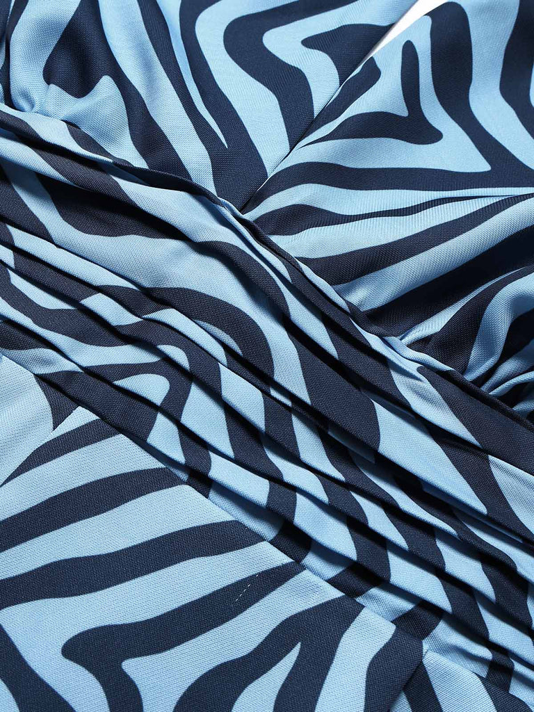 Seeblauer 70er Jumpsuit mit Zebra-Print und Neckholder