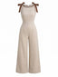 Beige 50er Jumpsuit mit Bindeträgern und Kontrast-Einfassung