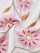 Rosa 60er Kleid mit Spaghettiträger und Blumen