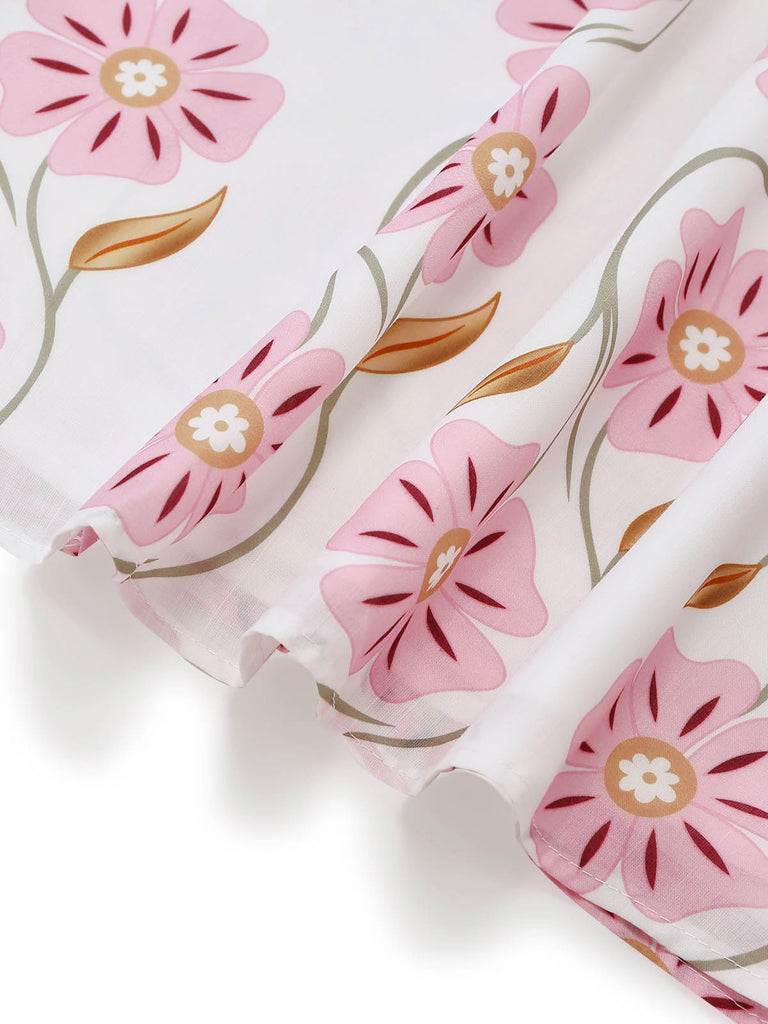 Rosa 60er Kleid mit Spaghettiträger und Blumen