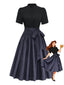 Schwarzes 50er Oktoberfest-Dirndl-Set mit Stehkragen und Blumenschürze