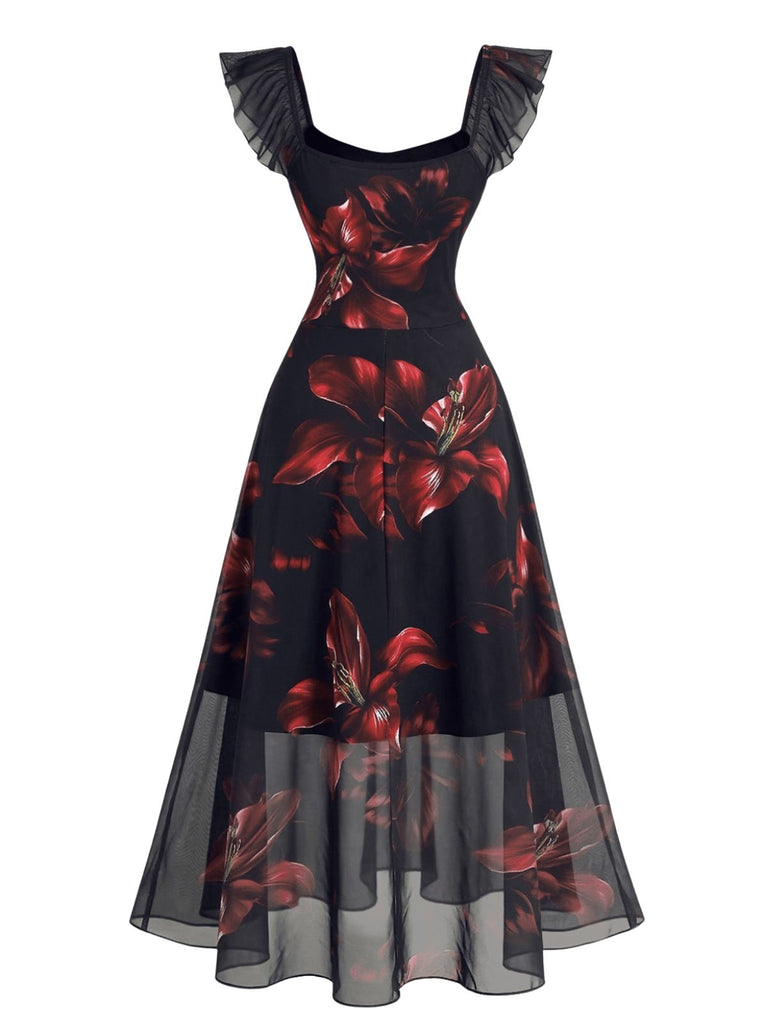 Schwarzes 40er Netzkleid mit roten Lilien und Rüschen