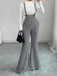 Schwarz-weißer 60er Overall-Jumpsuit mit Hahnentritt und Schlagbein