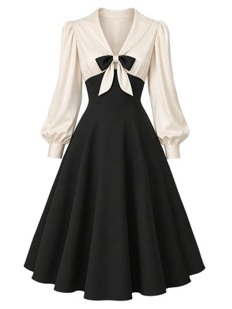 Creme-schwarzes 50er Kleid mit Schleife und Ballonärmeln