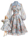 Blaues 50er Wickelkleid mit Blumen und Reverskragen