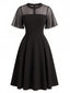 Schwarzes 50er Swingkleid mit Mesh-Einsatz und Flatterärmeln