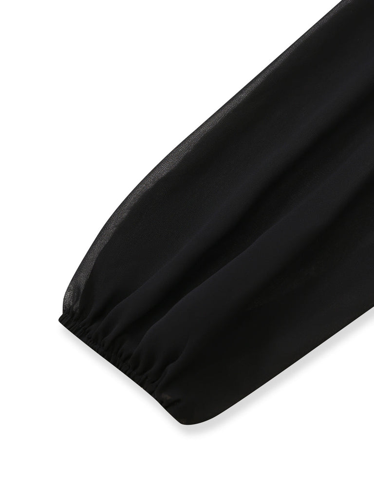Schwarzer 30er Jumpsuit mit transparenten Ballonärmeln und Schlitz