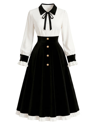 Schwarzes & weißes 50er Kleid mit Knöpfen, Kontrastschleife und Ballonärmeln