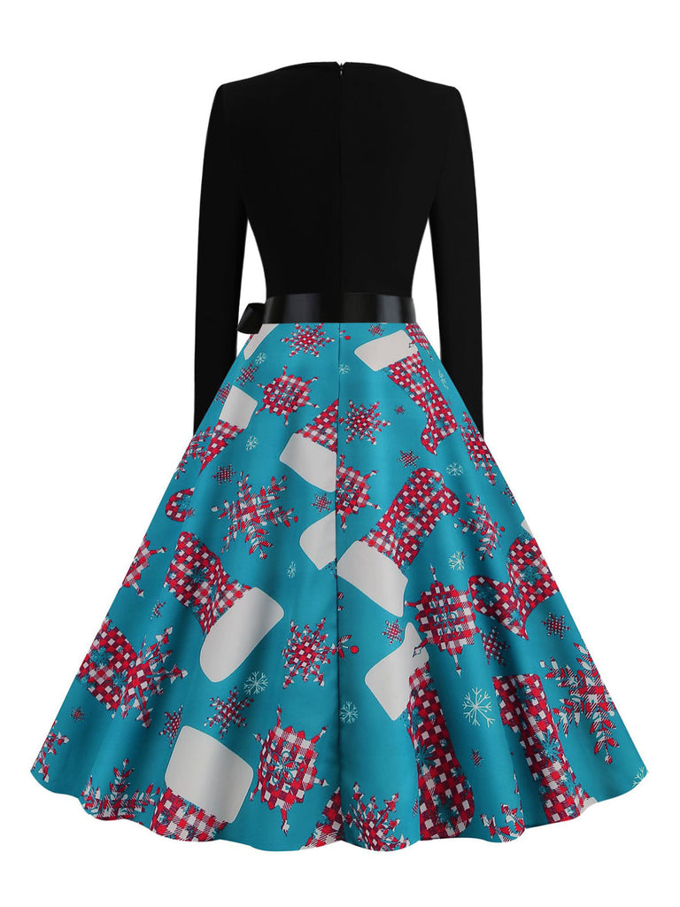 Blaues 50er Weihnachts-Swingkleid mit Strumpf-Print und Wellenausschnitt