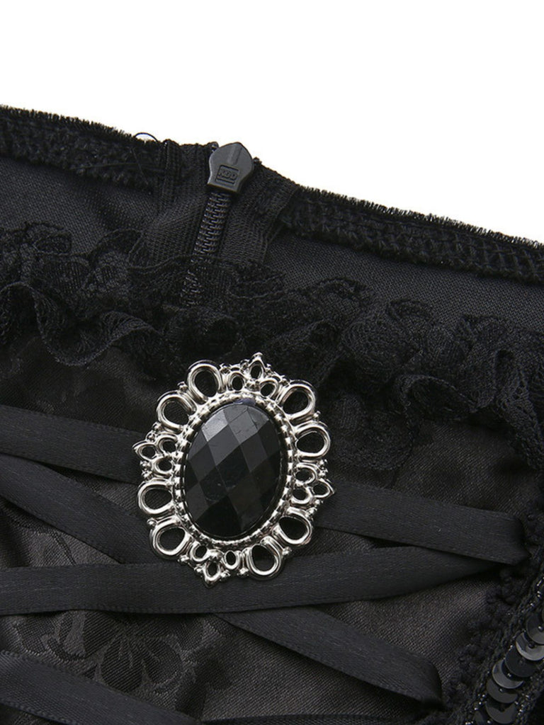 Schwarzes 50er Hexenkleid mit Federbesatz und ausgestellten Ärmeln