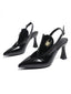 Schwarze Slingback-Pumps mit spitzer Zehenkappe und goldener Spinne