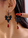 Gothic Schwarze Fledermaus-Ohrringe mit roten Kristallen