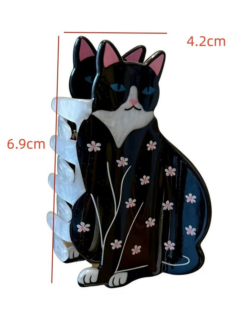 Schwarz-weiße katzenförmige Haarspange mit Blumenmuster