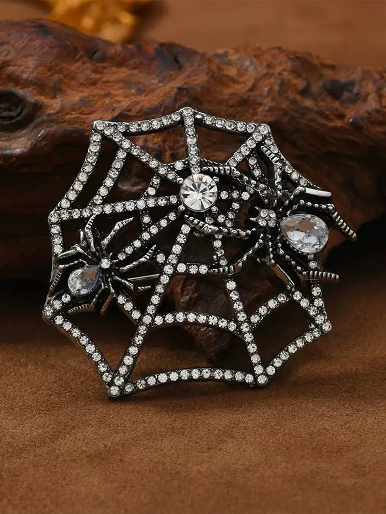 Brosche mit Strass und Spinnennetz