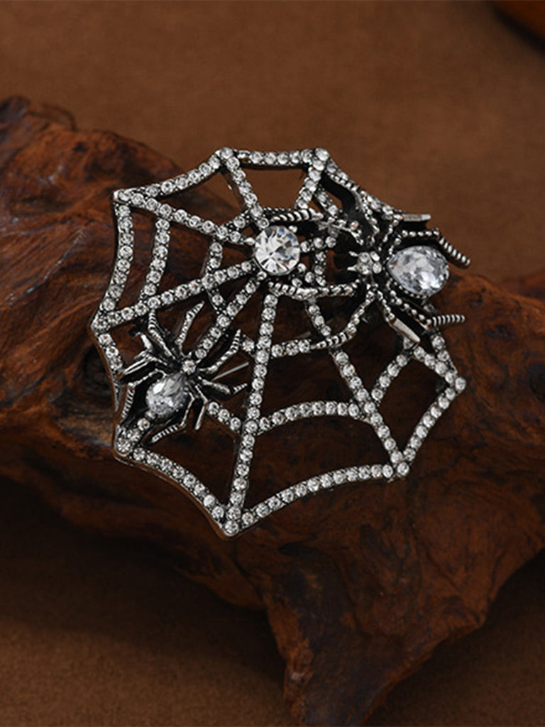 Brosche mit Strass und Spinnennetz