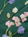 GRÜNER PATCHWORK JUMPSUIT MIT BLUMEN-3D-RIEMEN