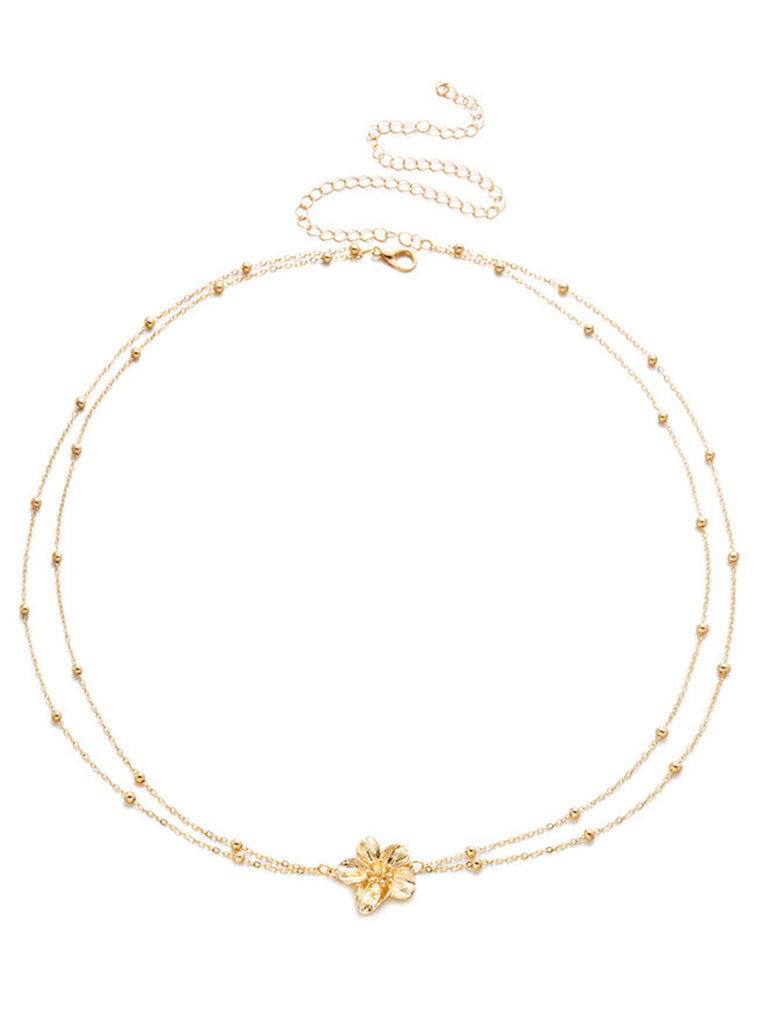 Golder Body mit Blumen und Perlen