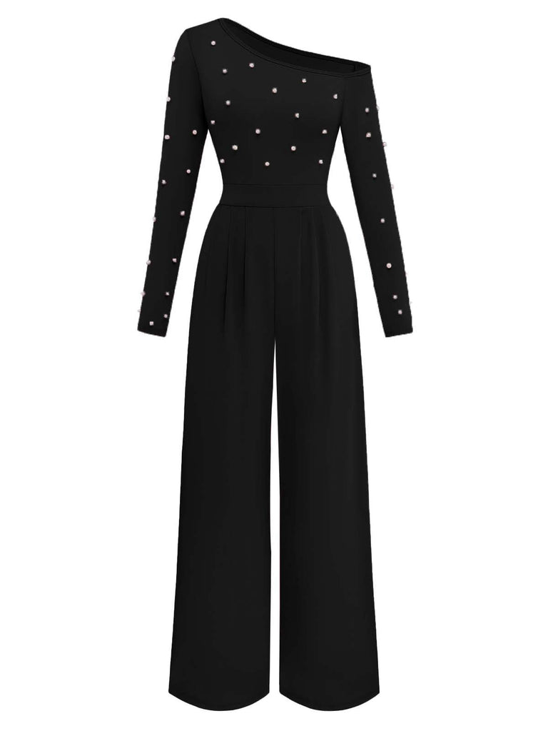 Schwarzer Jumpsuit mit Perlenverzierungen auf weißem Hintergrund