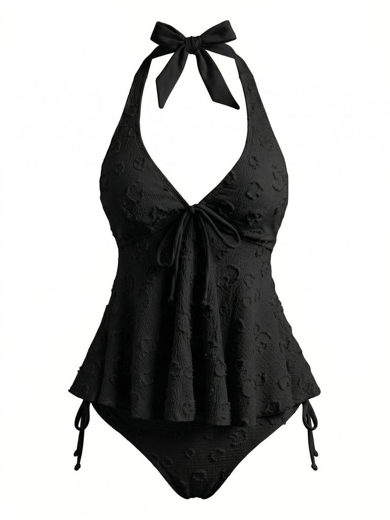Retro-Tankini im Stil der 50er Jahre mit strukturiertem Blumenmuster, tiefem V-Ausschnitt und Neckholder-Trägern für einen klassischen Strandlook.