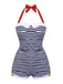 A retro-style navy blue and white horizontal striped one-piece swimsuit featuring a red polka dot halter neck tie and a white collar detail.