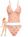 Vintage-Tankini-Badeanzug in Orange aus den 1970er Jahren mit tiefem V-Ausschnitt und zartem Blumenmuster, perfekt für Strandurlaube und zum Entspannen am Pool.