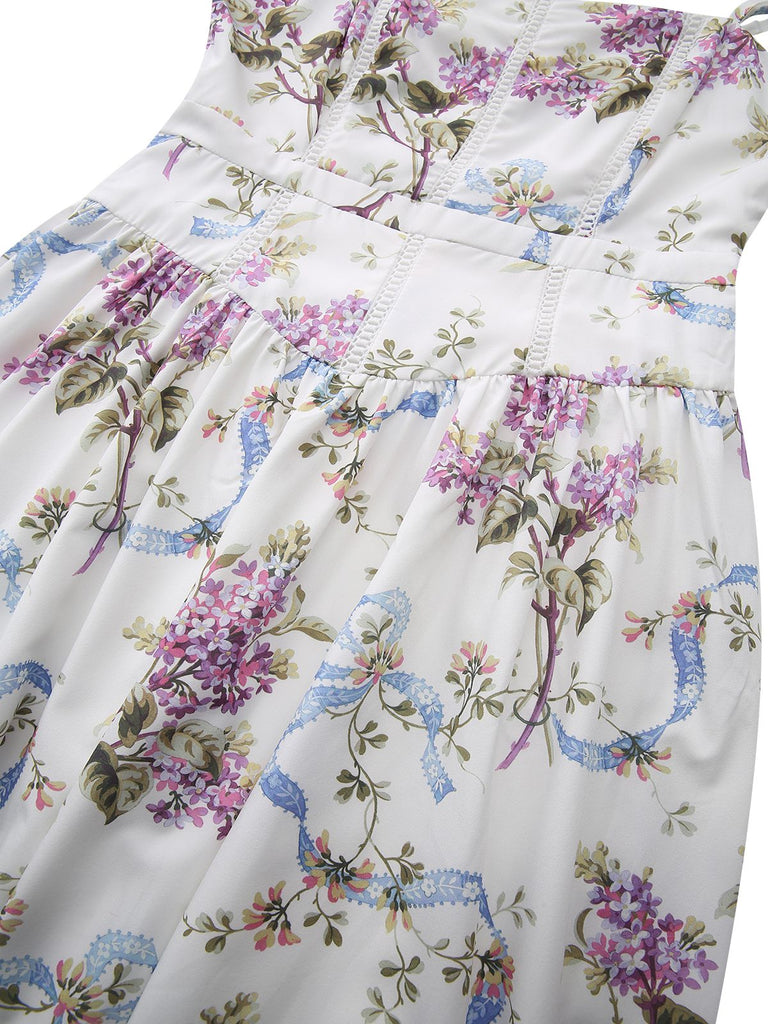 Detailansicht der taillierten Silhouette und der strukturierten Oberteilnähte mit dem blauen Band- und Blumenmotiv.